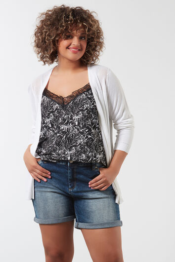 Openvallend vest met open structuur